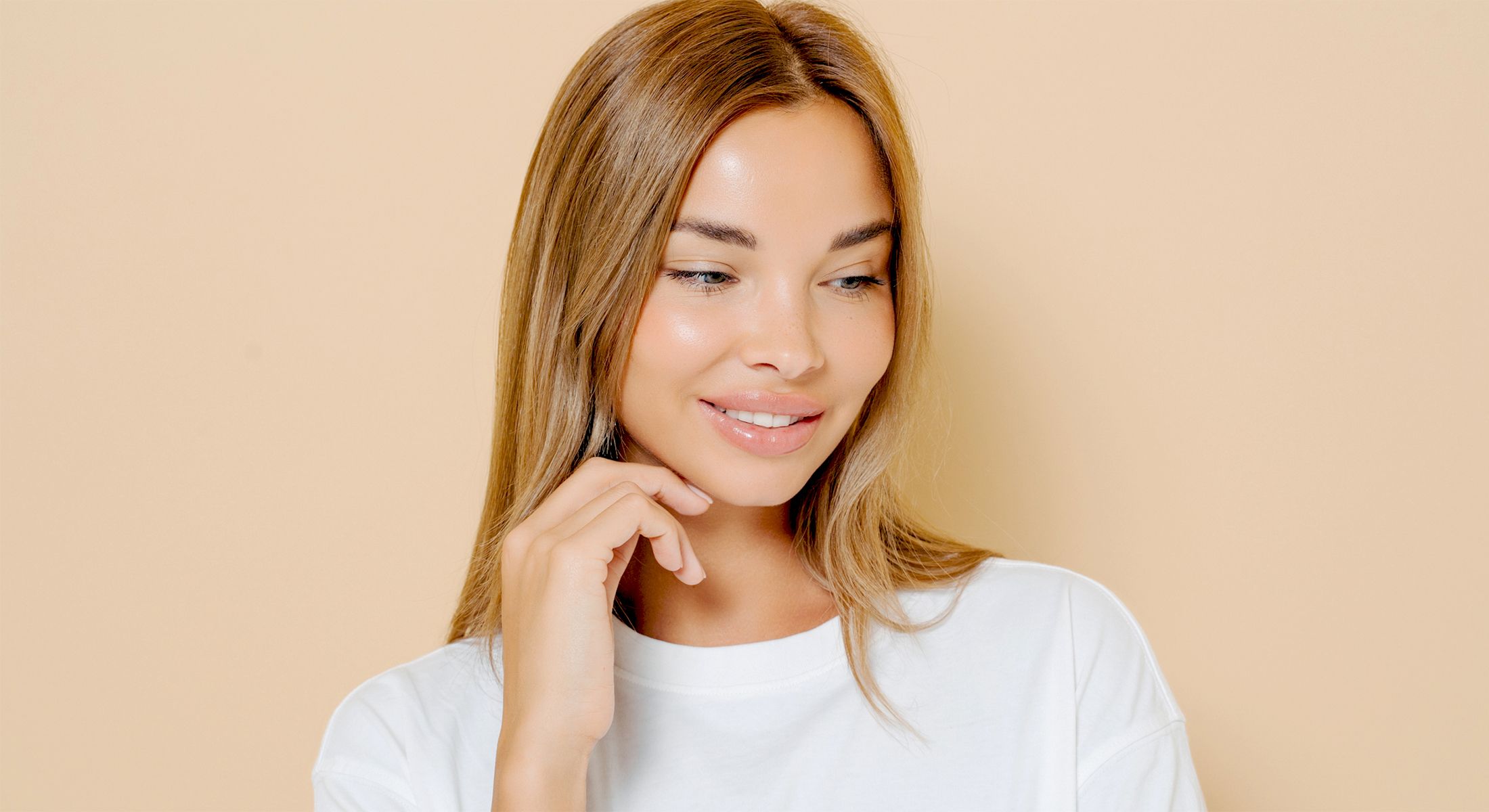 vi peel patient model in a white shirt smiling