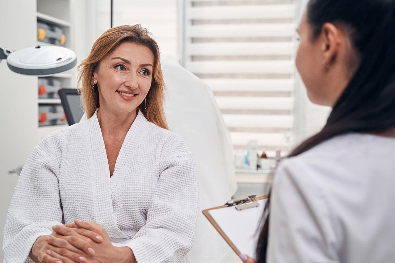 Woman consulting with a professional in a spa.