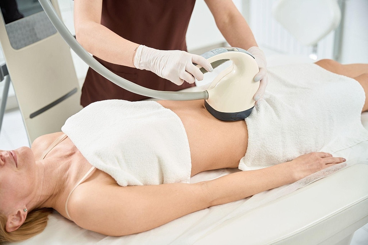 Woman receiving cosmetic treatment in clinic.