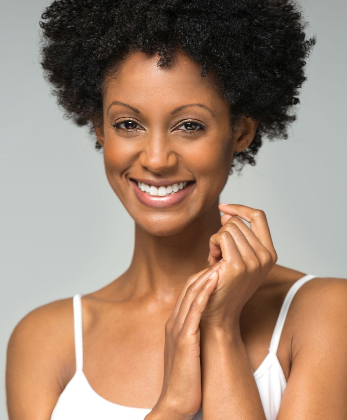 laser skin resurfacing patient model in a white tank top smiling